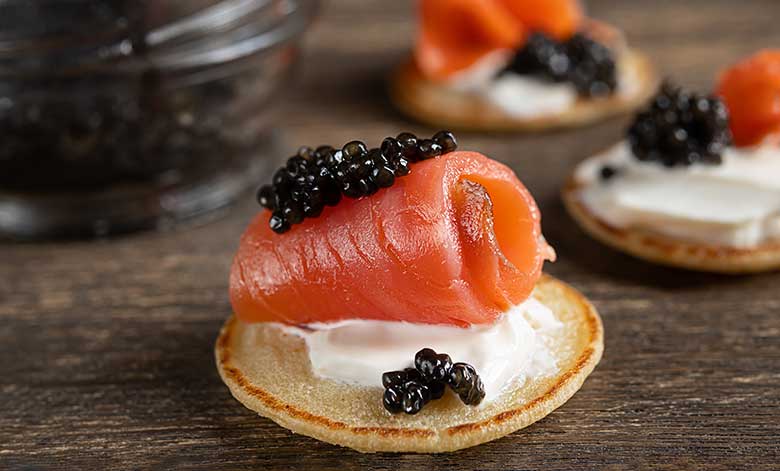 A selection of caviar served with blinis